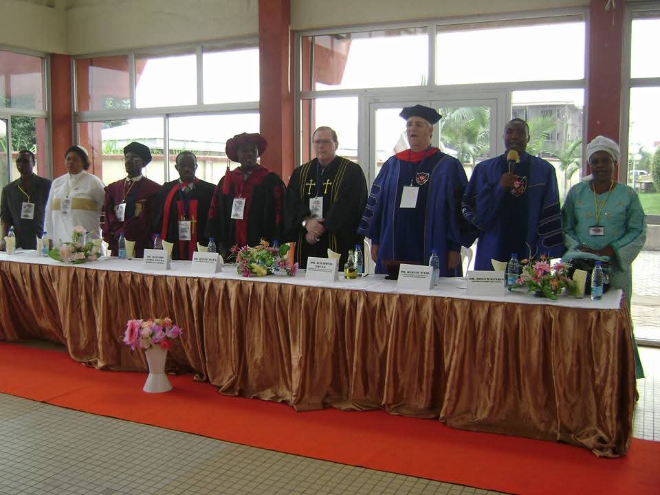The platform party of ICOF Global University standing at the high table during a congregation
